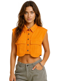 Thumbnail for Woman wearing an orange sleeveless top on a white background