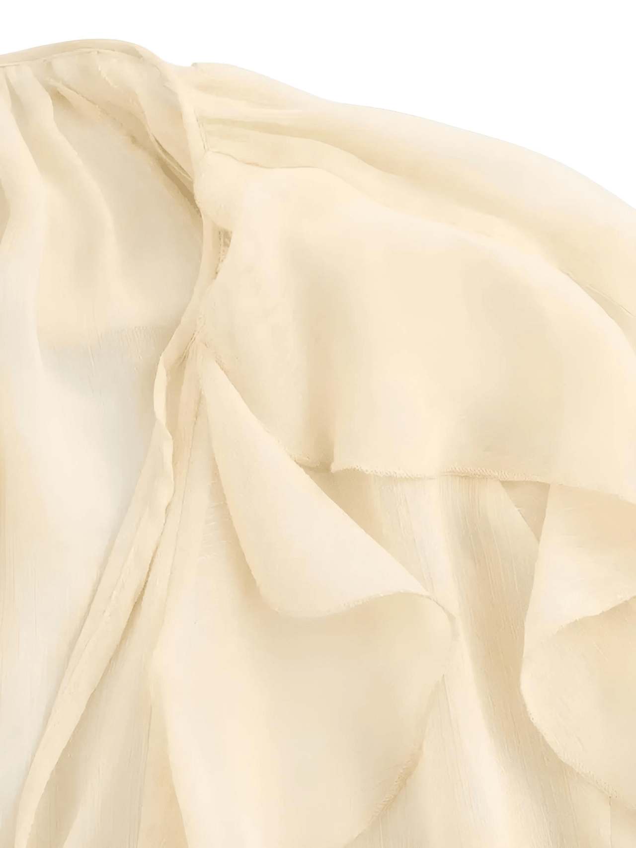 Close-up of beige fabric with folds on a light background