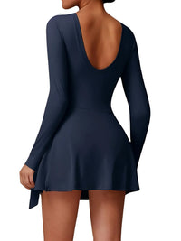 Thumbnail for Navy blue dress with long sleeves and open back on a white background