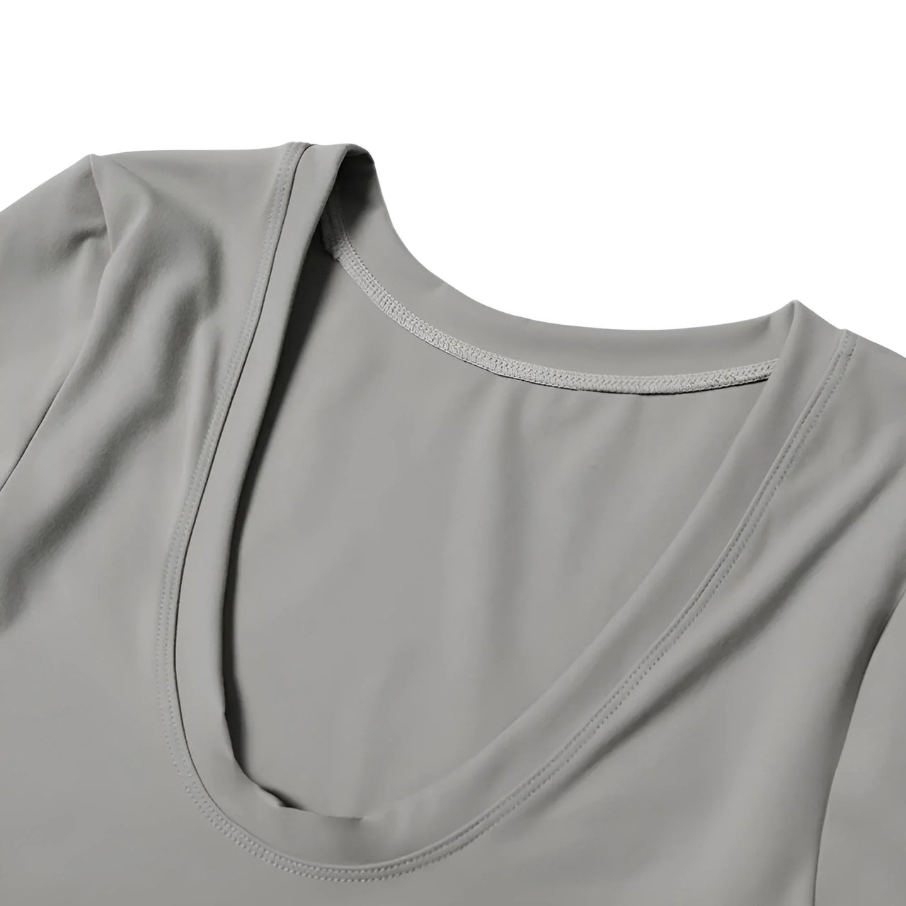 Close-up of a gray tank top with a scoop neckline on a white background