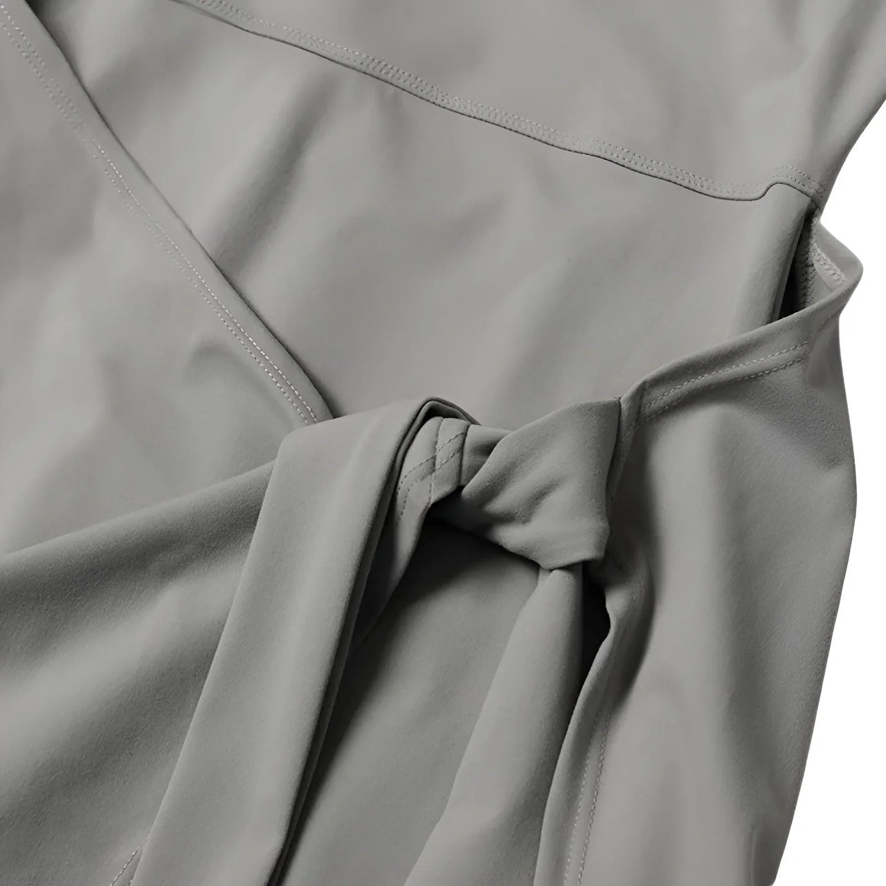 Close-up of a gray fabric with folds on a white background
