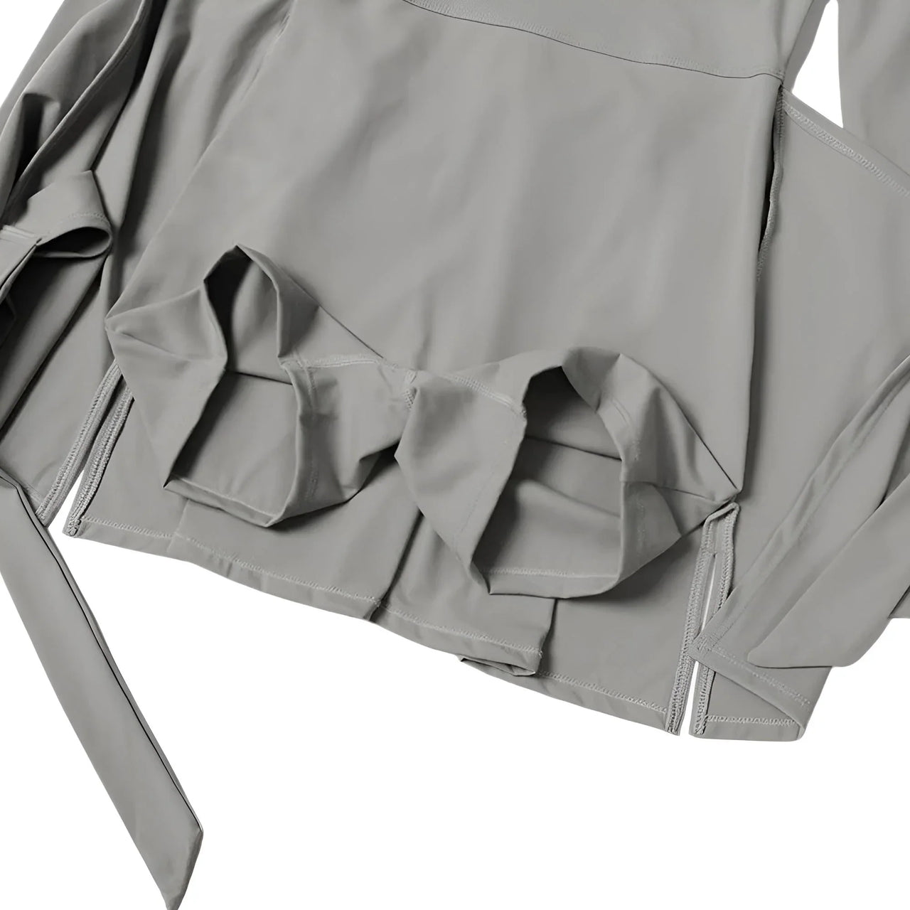 Gray jacket with ruffled details on a white background