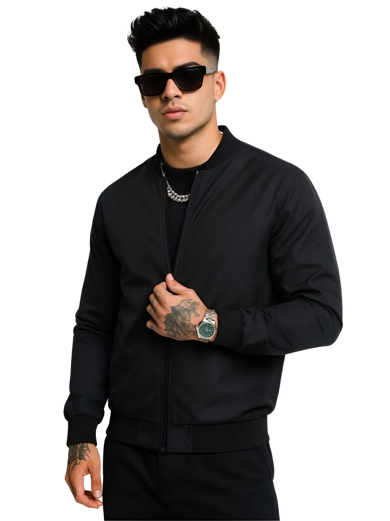 Man wearing a black bomber jacket and sunglasses on a white background
