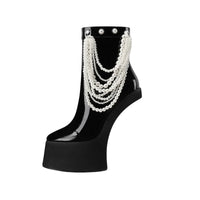 Thumbnail for Black high-heeled shoe with pearl embellishments on a white background
