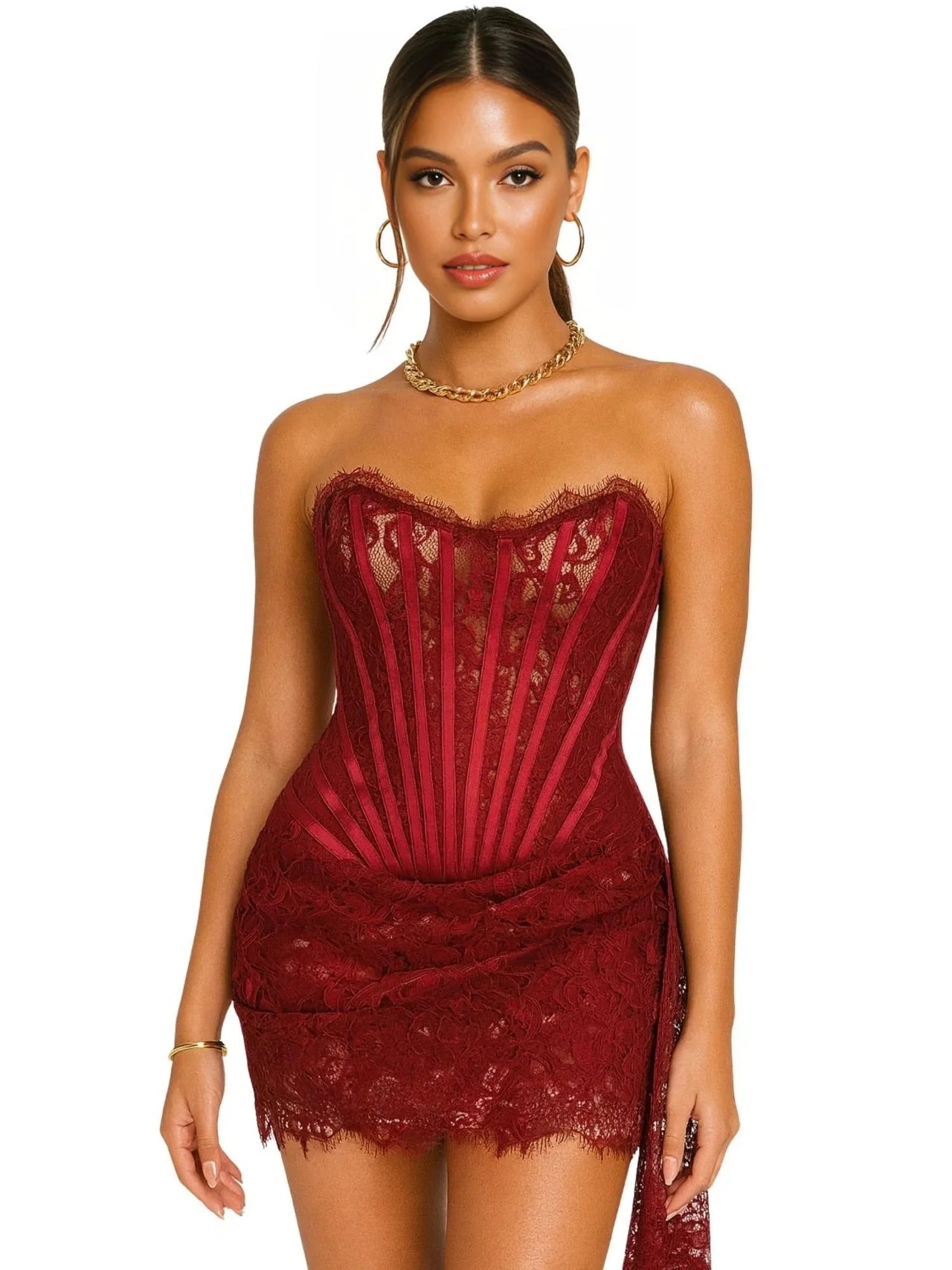 Woman wearing a strapless red lace dress on a white background