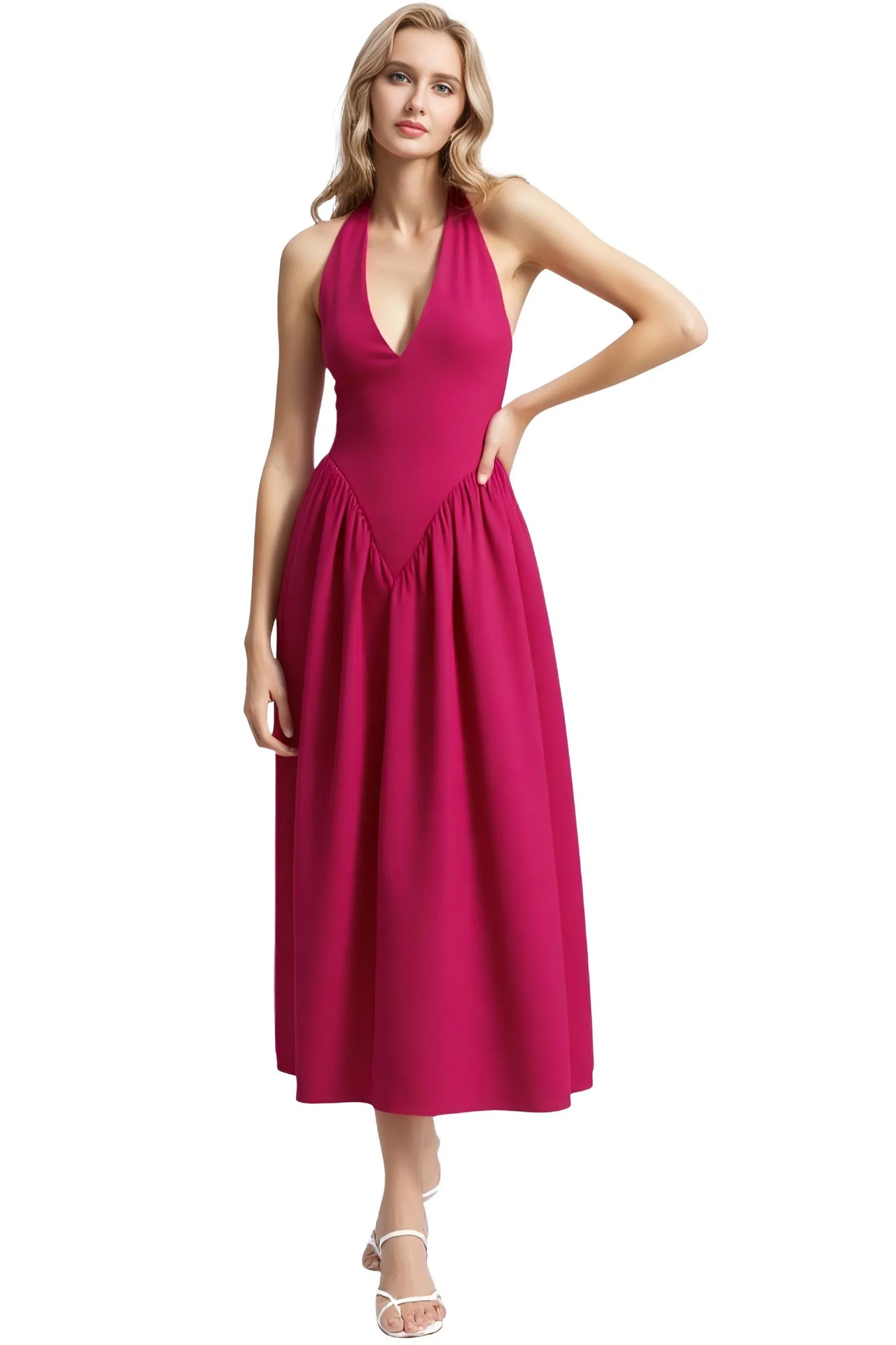 Woman wearing a pink halter neck dress on a white background