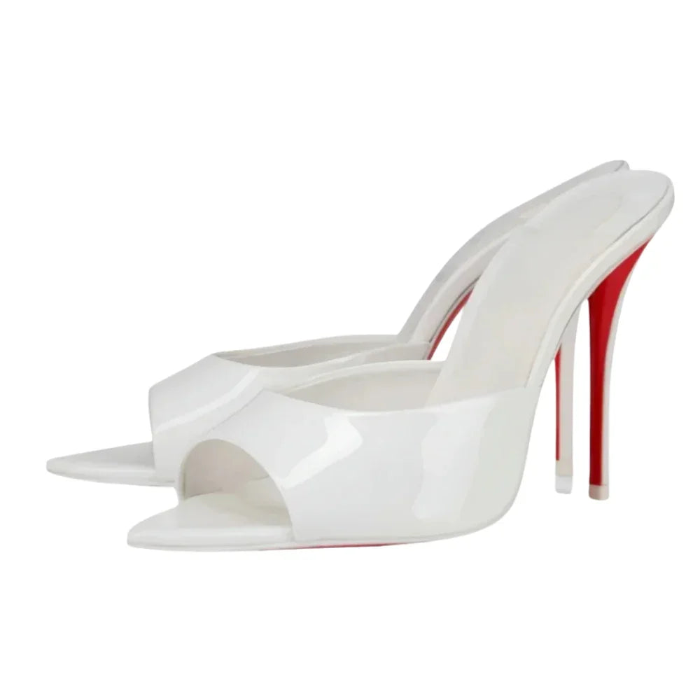 White high-heeled shoe with red sole on a white background