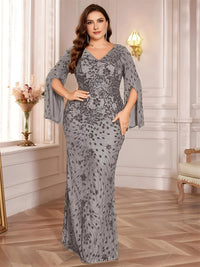 Thumbnail for Woman wearing a gray sequin evening dress in an elegant room with white walls and wooden floor.