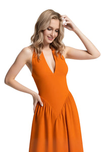 Thumbnail for Woman wearing an orange dress on a white background
