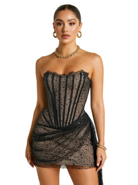 Thumbnail for Woman wearing a black strapless dress with sequins on a white background