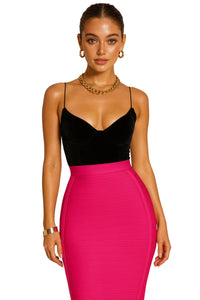 Thumbnail for Woman wearing a black top and pink pencil skirt with gold jewelry on a white background