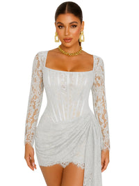 Thumbnail for Woman wearing a white lace dress with long sleeves on a white background