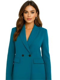 Thumbnail for Woman wearing a teal blazer on a white background