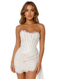 Thumbnail for Woman wearing a white lace strapless mini dress on a white background