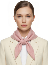 Thumbnail for Woman wearing a pink wool scarf around her neck against a white background