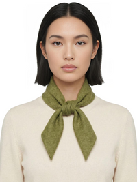 Thumbnail for Woman wearing a green wool scarf around her neck against a white background