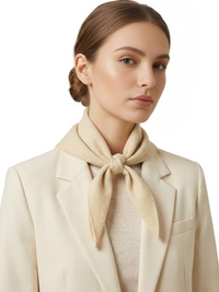 Thumbnail for Woman wearing a beige scarf and coat on a white background
