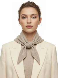 Thumbnail for Woman wearing a khaki wool scarf and cream blazer on a white background