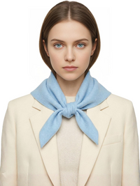 Thumbnail for Woman wearing a blue wool scarf around her neck against a white background