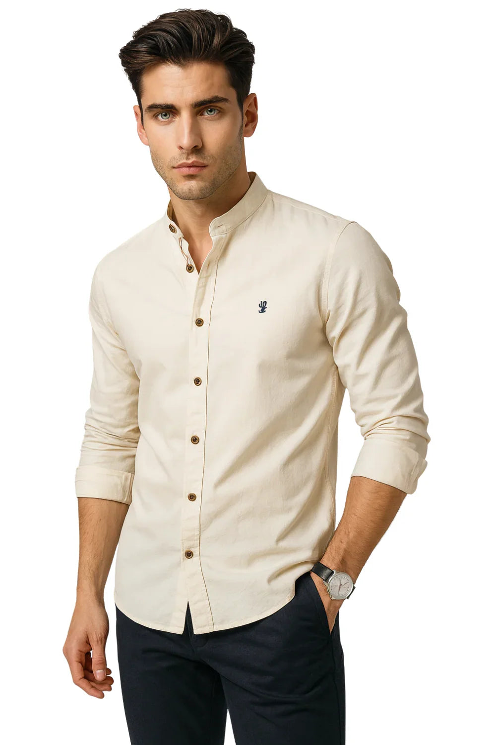 Man wearing a beige button-up shirt with a small logo on a white background