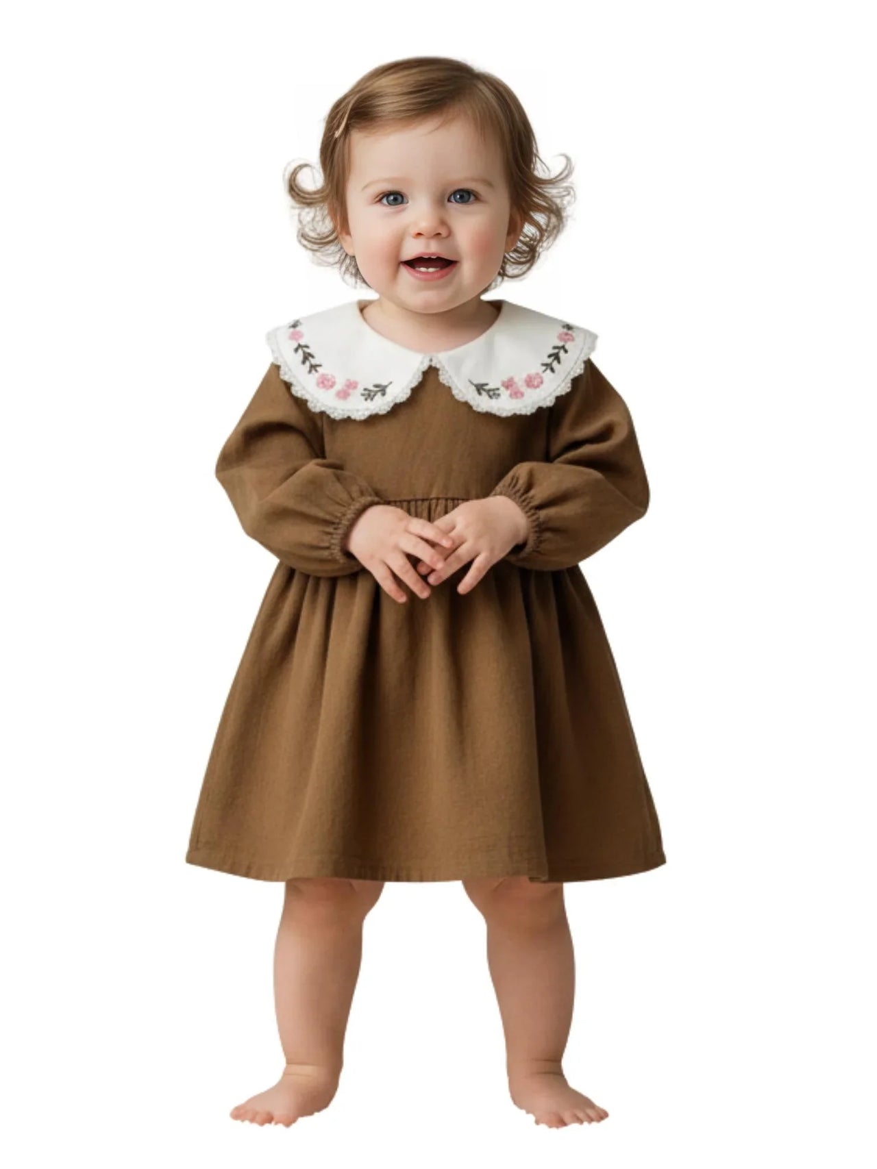 Child wearing a brown dress with a white embroidered collar on a white background