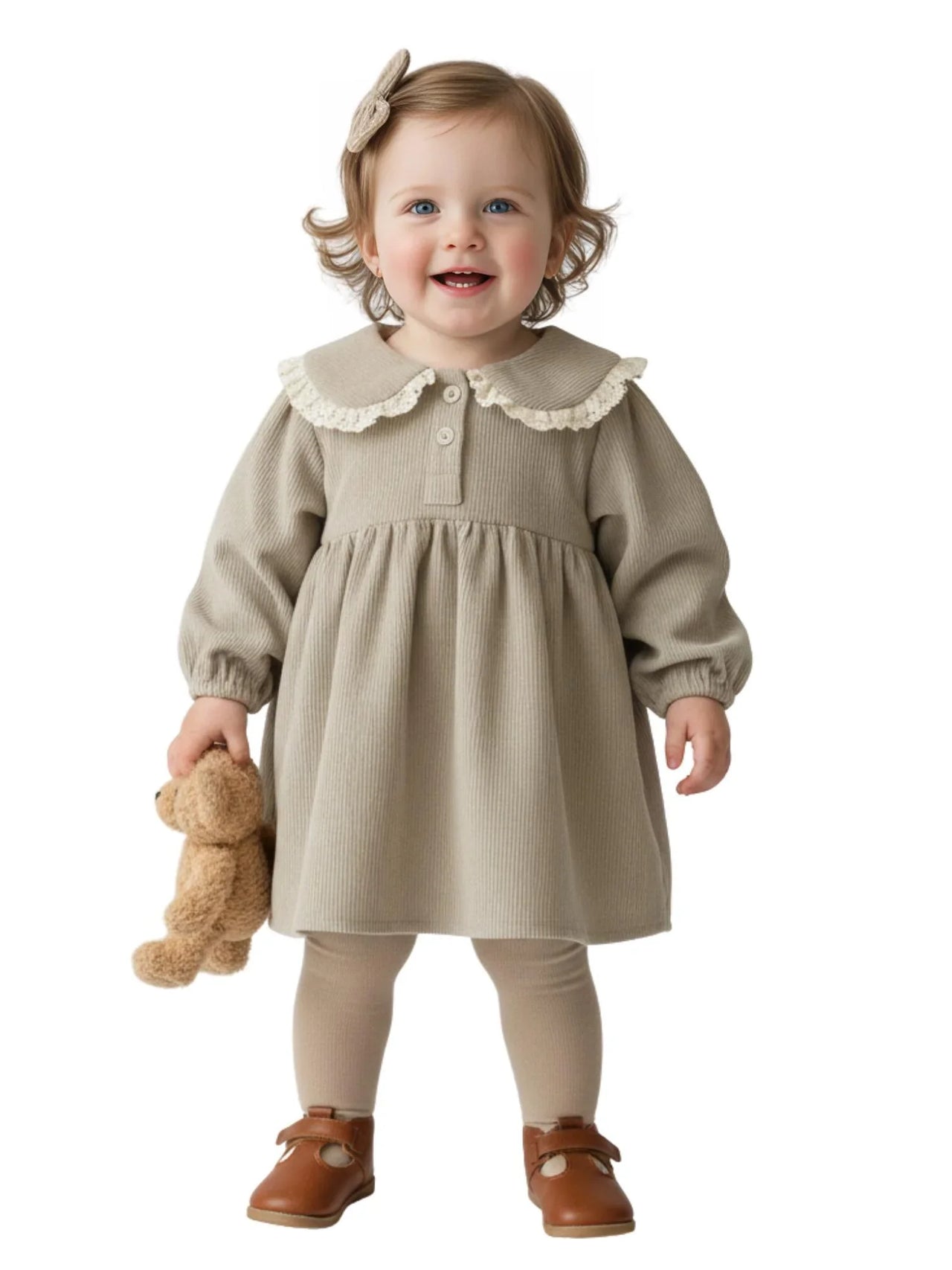 Child wearing a beige dress with white lace on collar, holding a teddy bear on a white background