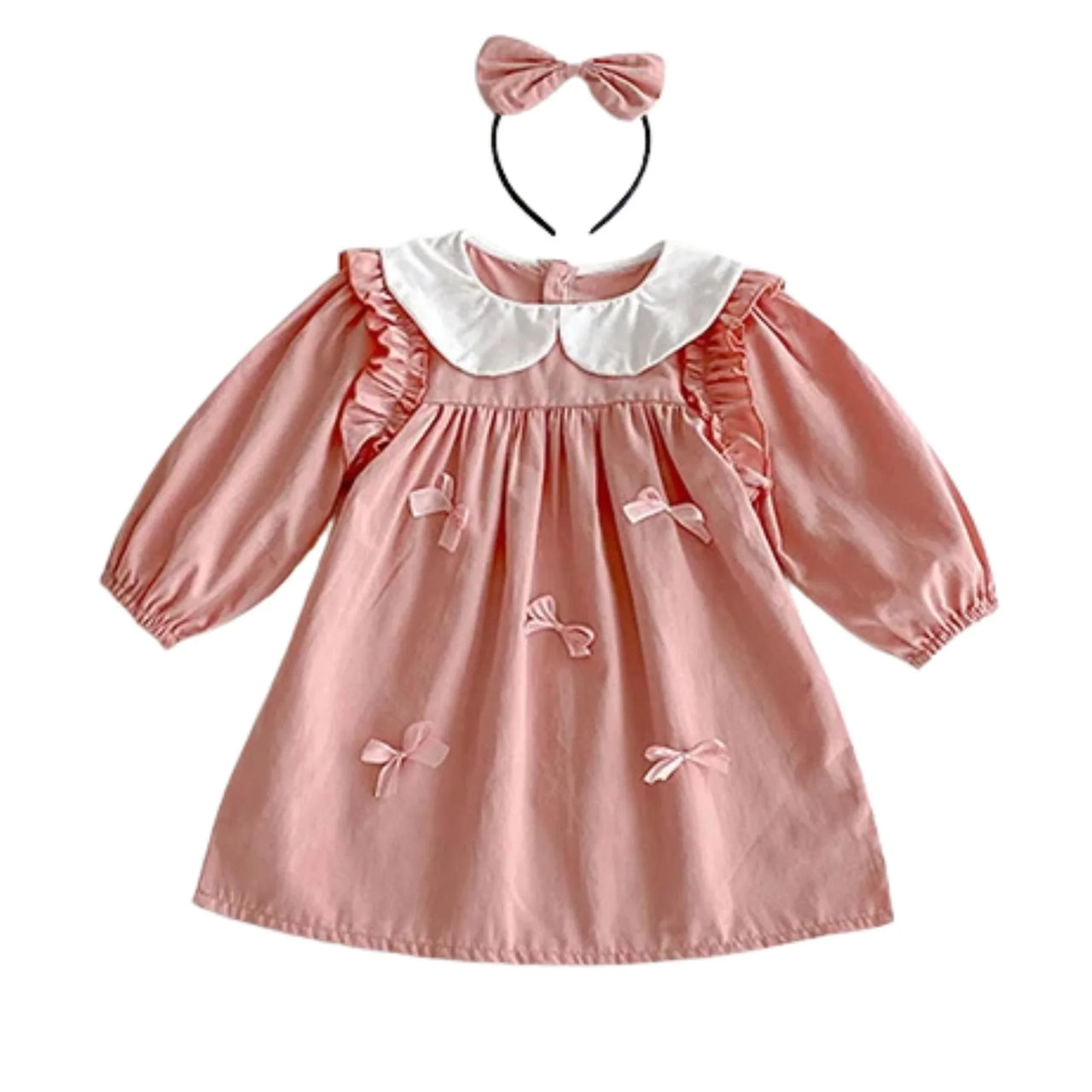 Pink dress with white collar and bow details, accompanied by a matching headband on a white background.
