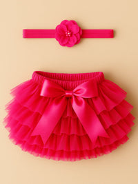 Thumbnail for Pink tutu skirt with bow and matching headband on a beige background