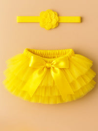 Thumbnail for Yellow tutu skirt with matching headband on a beige background