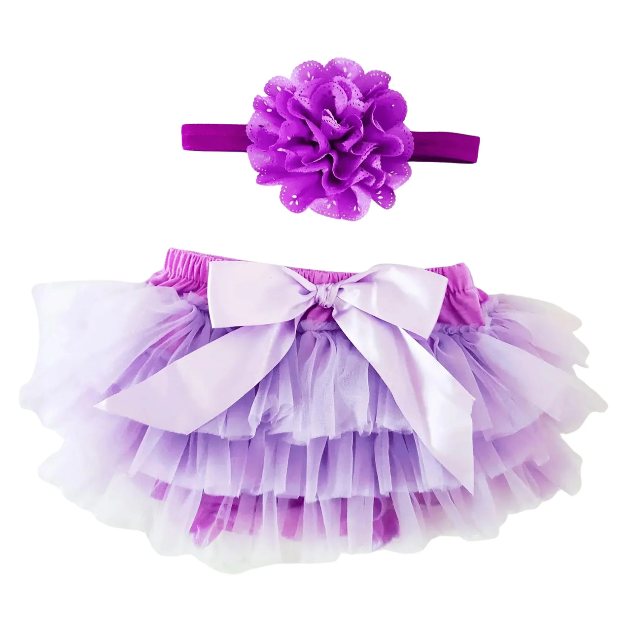 Purple tutu skirt with matching headband on a white background
