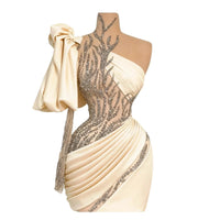 Thumbnail for Beige dress with silver embellishments on a mannequin against a white background