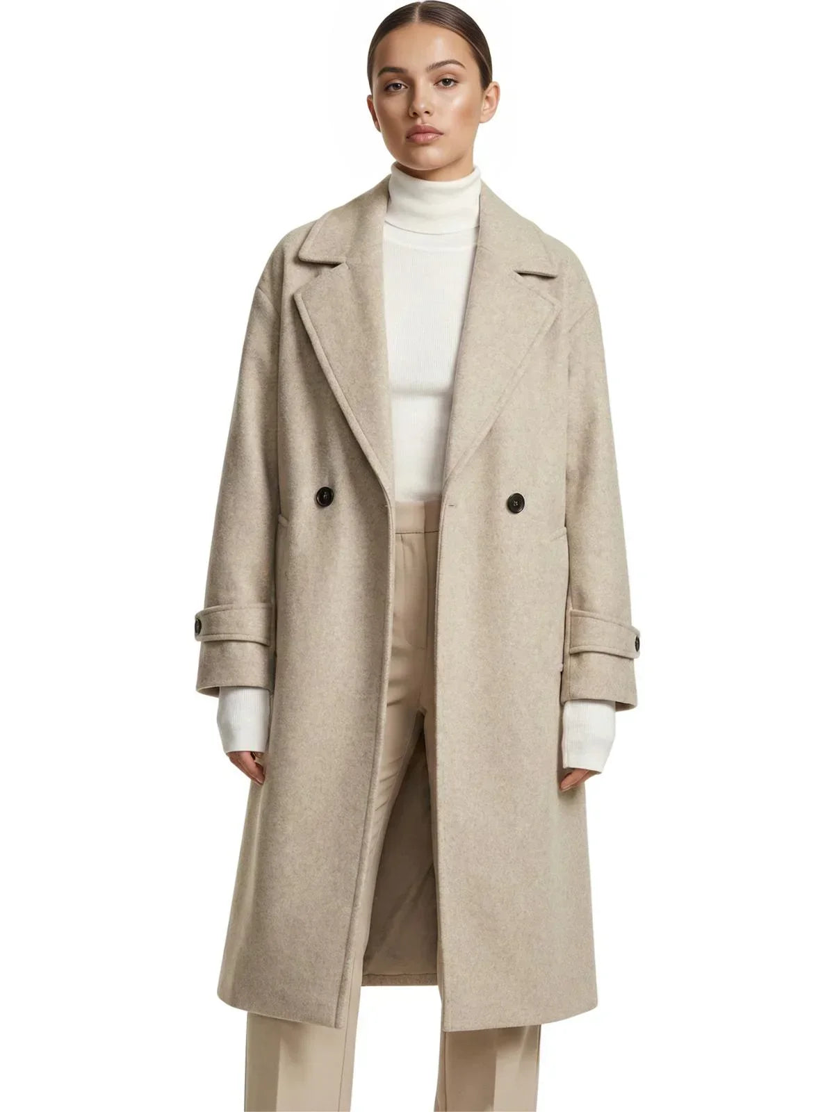 Woman wearing a long beige oversized double breasted coat with pockets and turn down collar on a white background.