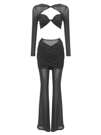 Thumbnail for Woman's sheer 2 piece black pant set with a hollow out crop top on a white background