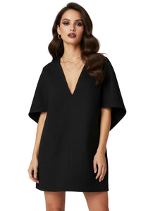 Thumbnail for Woman wearing a black mini dress with cape sleeves on a white background