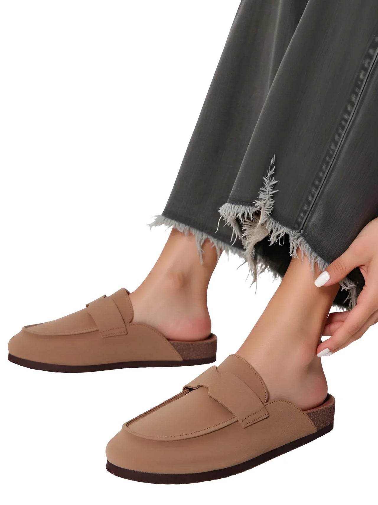 Pair of women's brown Birkenstock style suede sandals on a white background