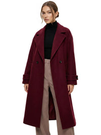 Thumbnail for Woman wearing a long wine red oversized double breasted coat with pockets and turn down collar on a white background.