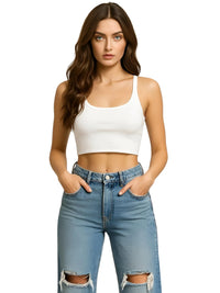 Thumbnail for Woman wearing a white crop top and blue jeans on a white background