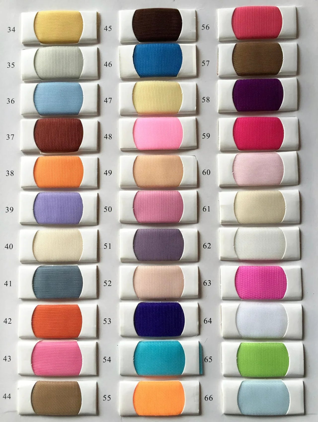 Color swatch chart with various fabric colors on a gray background