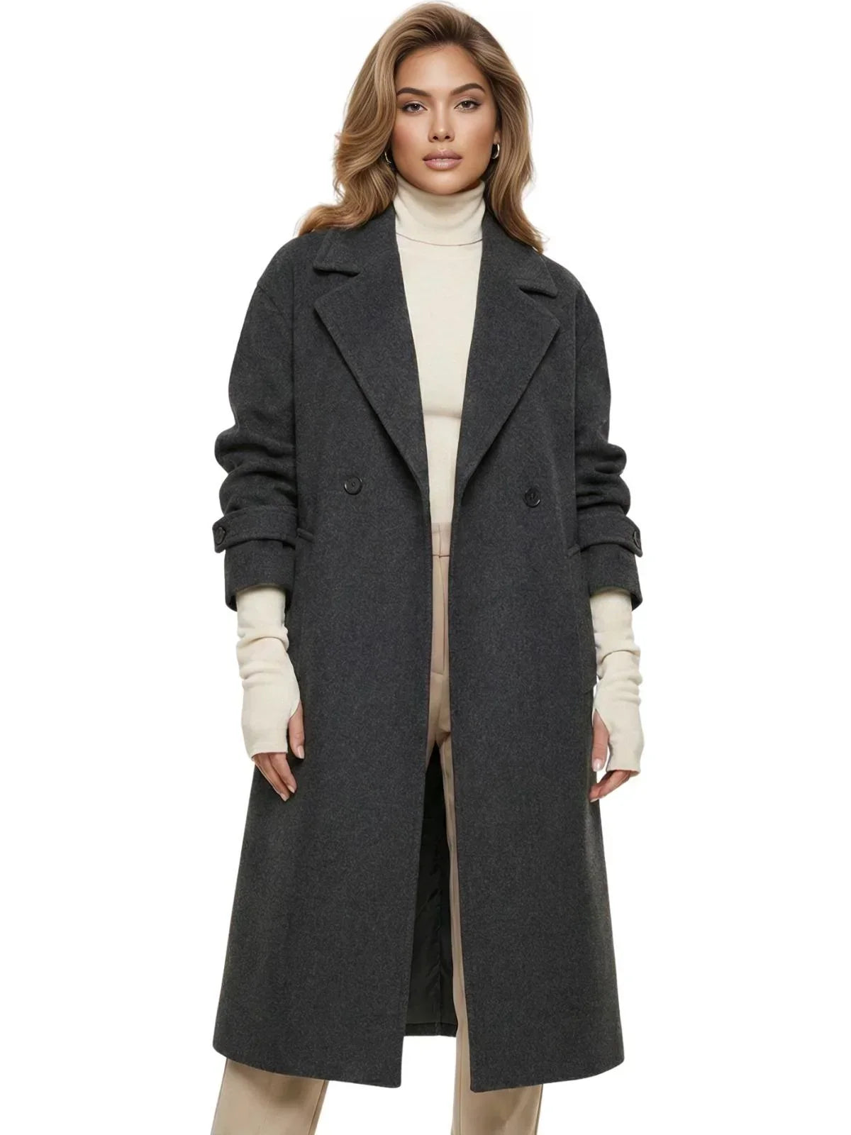 Woman wearing a long dark grey oversized double breasted coat with pockets and turn down collar on a white background.