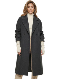 Thumbnail for Woman wearing a long dark grey oversized double breasted coat with pockets and turn down collar on a white background.