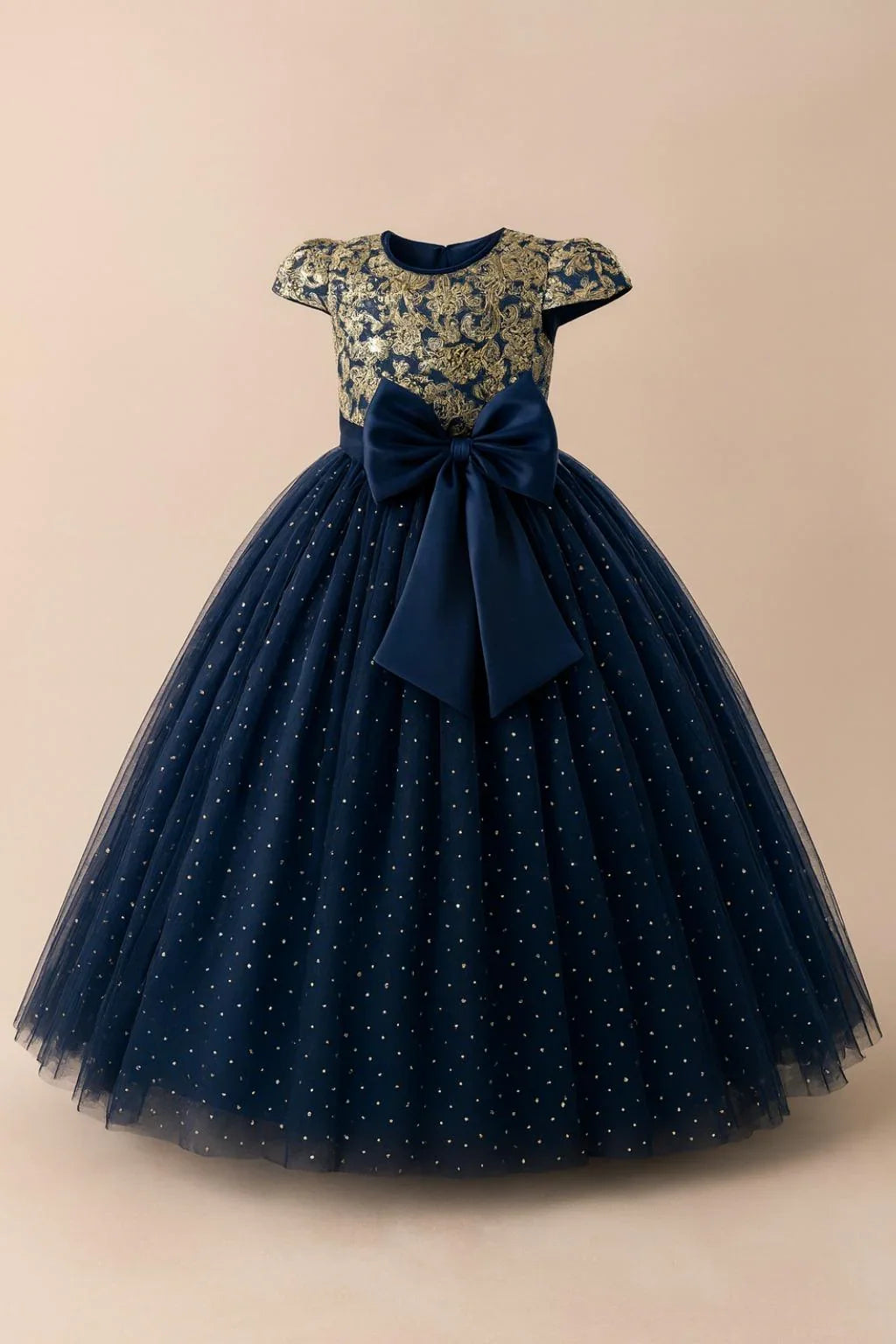 Navy blue dress with floral top and bow on a beige background