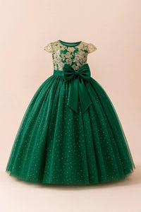 Thumbnail for Green dress with floral top and large bow on a beige background