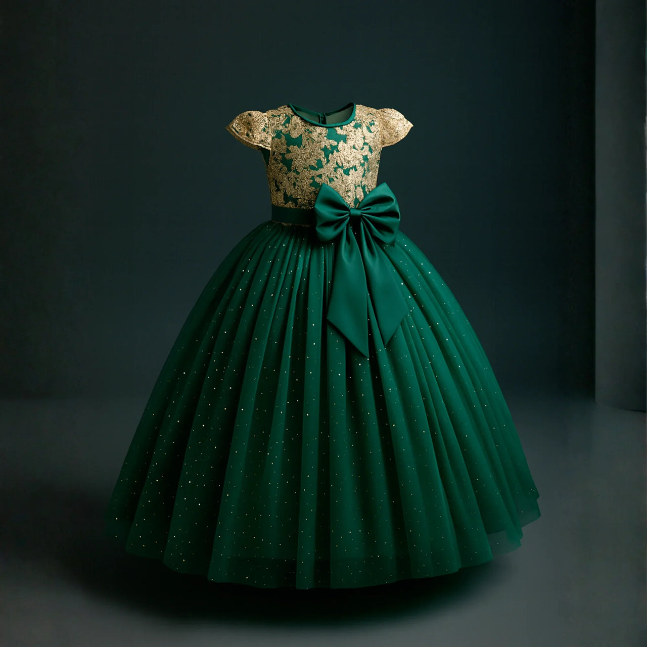 Green dress with gold lace top on a dark background