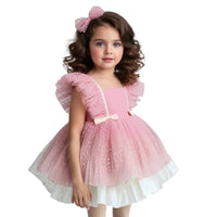 Thumbnail for Young girl wearing a pink dress with white accents on a white background