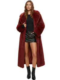 Thumbnail for Woman wearing a long dark red fur coat on a white background