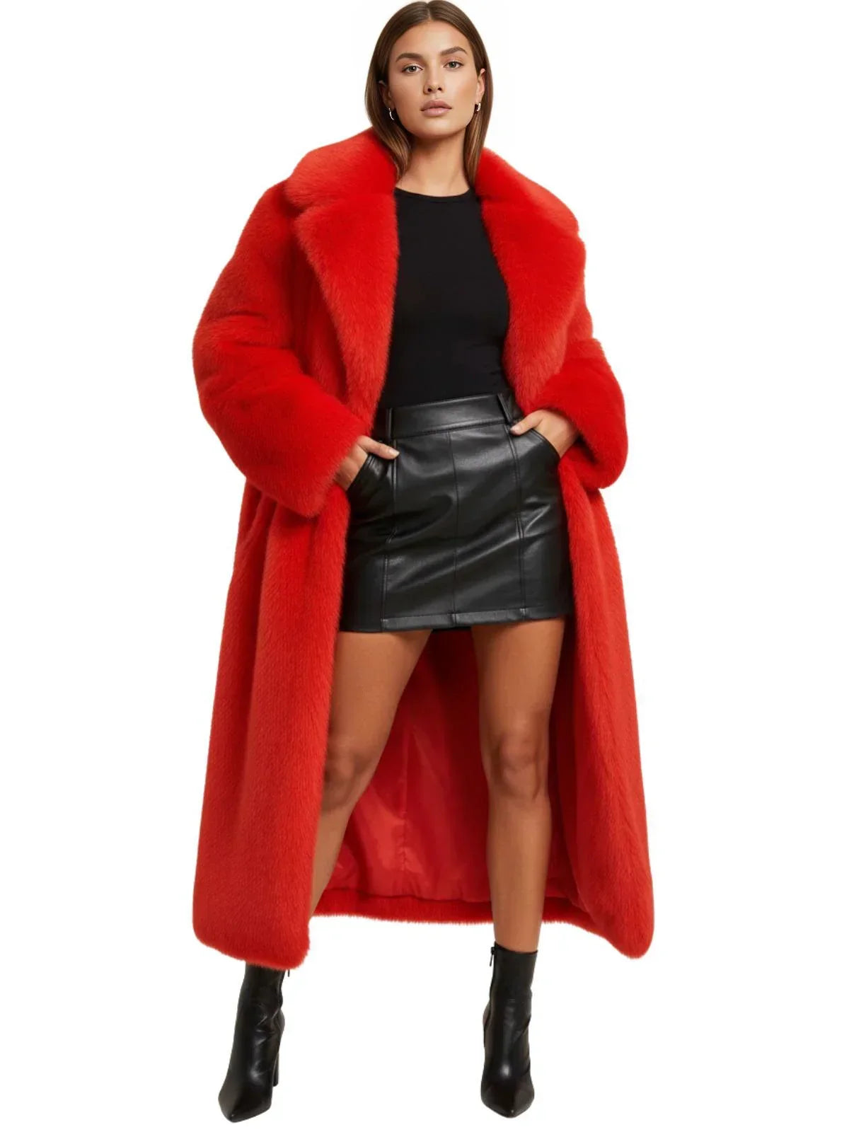 Woman wearing a long red fur coat over a black top and leather skirt on a white background
