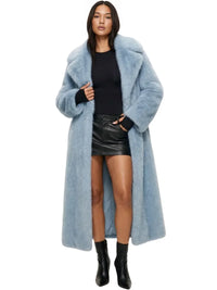 Thumbnail for Woman wearing a long light blue fur coat on a white background