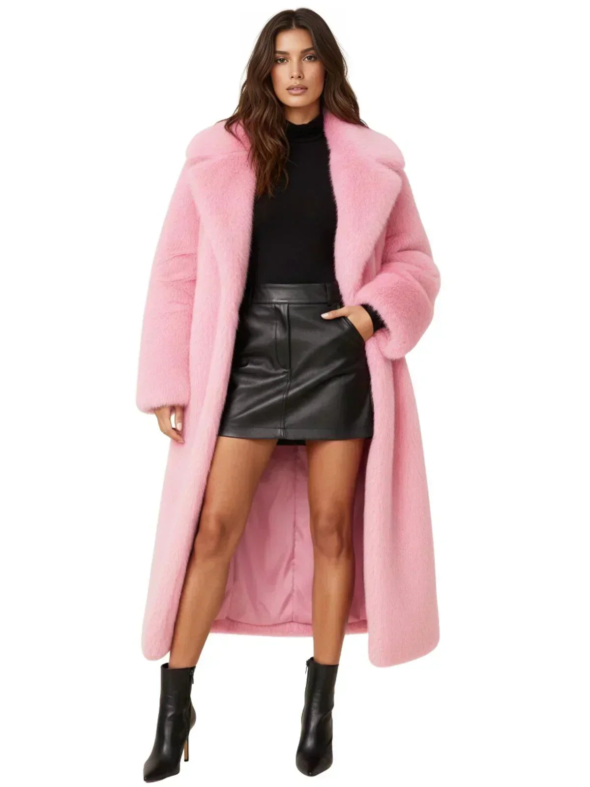Woman wearing a long pink fur coat, black top, and leather skirt on a white background