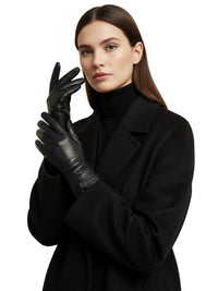 Thumbnail for Woman wearing black leather gloves and a black coat on a white background