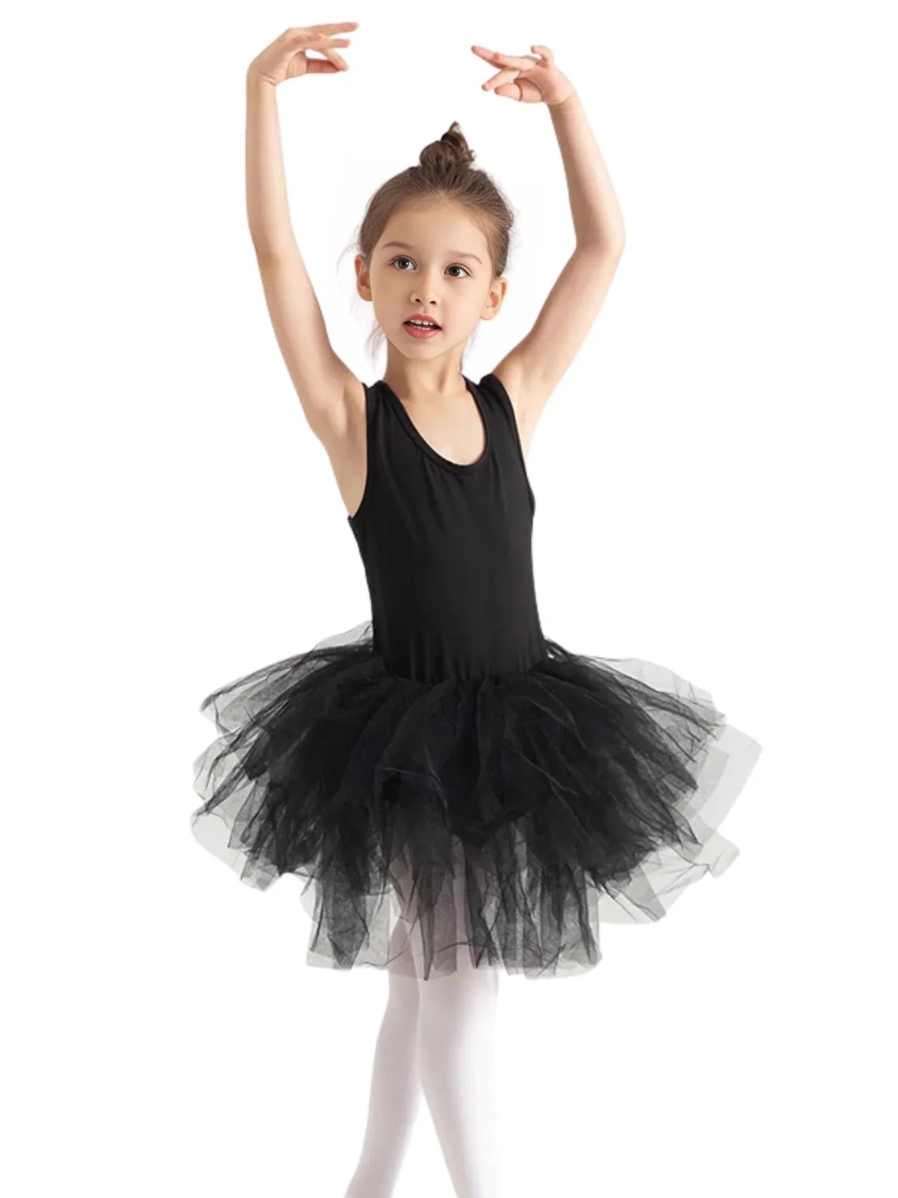 Young girl in a black sleeveless ballet tutu dress on a white background